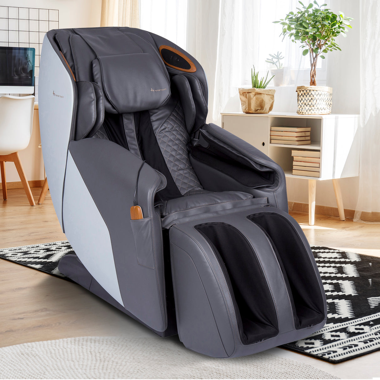 Quies Massage Chair in gray with full-body massage features, designed for relaxation and therapeutic comfort at home.