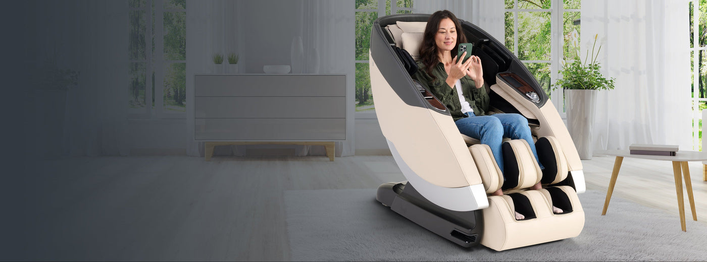 Woman looking at her phone while sitting on a Super Novo 2.0 in Cream