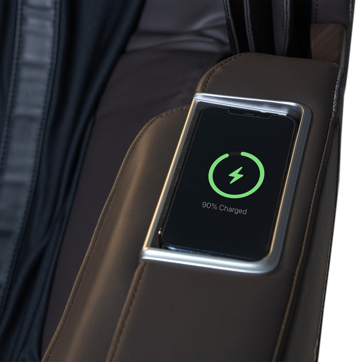 WholeBody® ROVE Massage Chair close-up of armrest with built-in phone charging dock showing 90% charged phone screen.