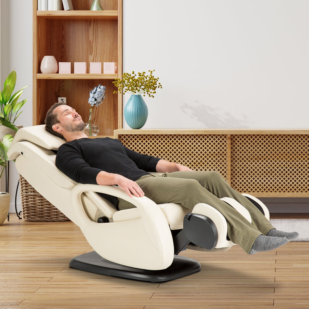 WholeBody 5.1 massage chair in cream color shown in modern living room with person relaxing in reclined position