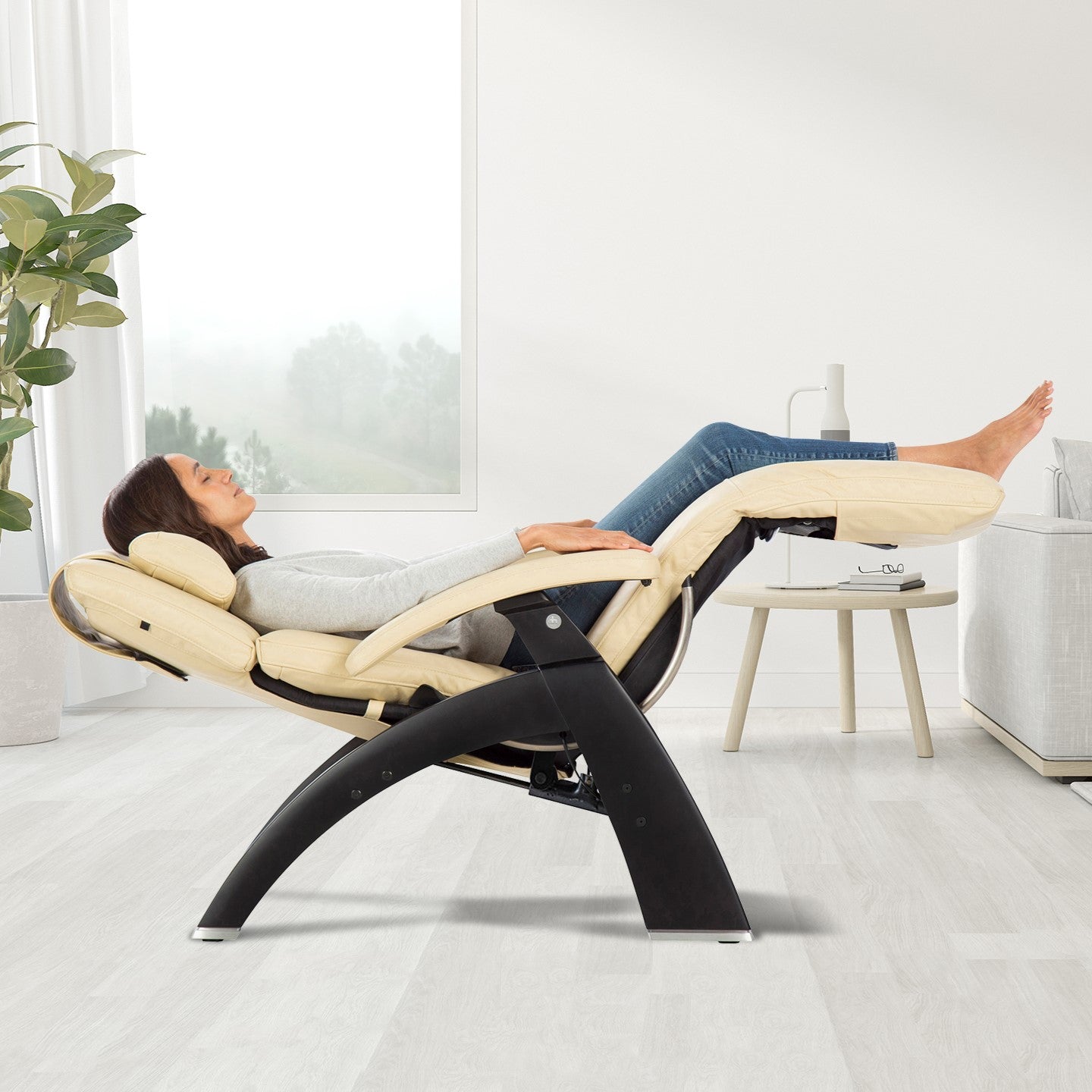 Perfect Chair PC-420 Classic Manual Plus zero gravity recliner shown in ivory color with person relaxing in neutral posture