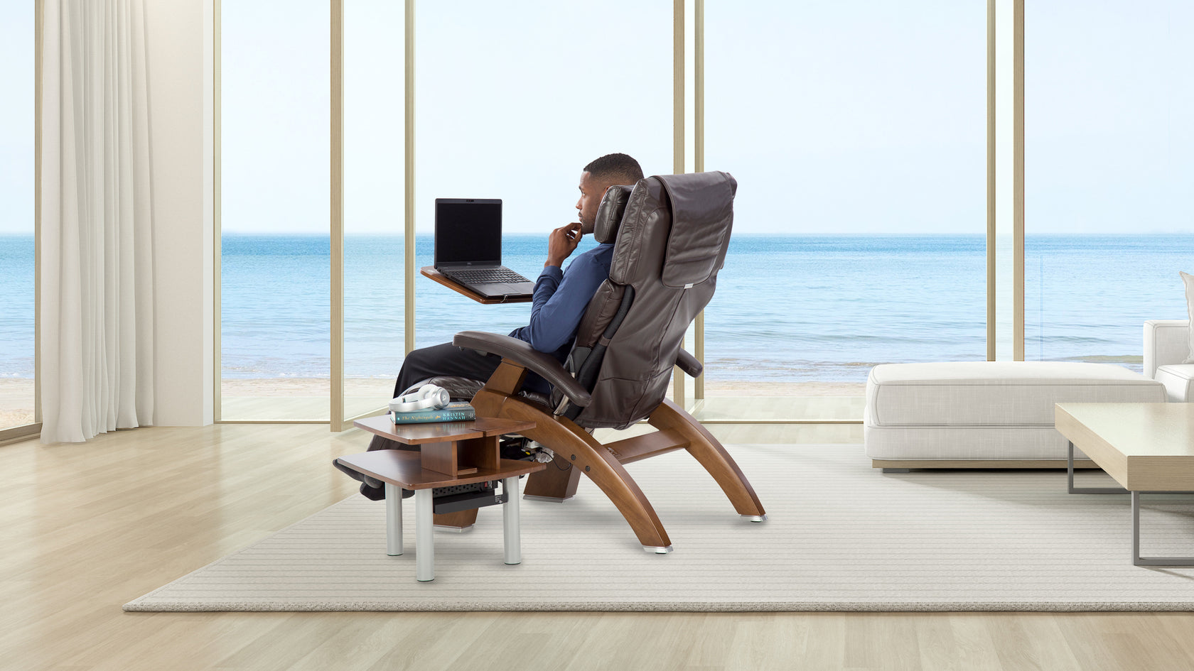 Man looking at laptop on Perfect Chair 