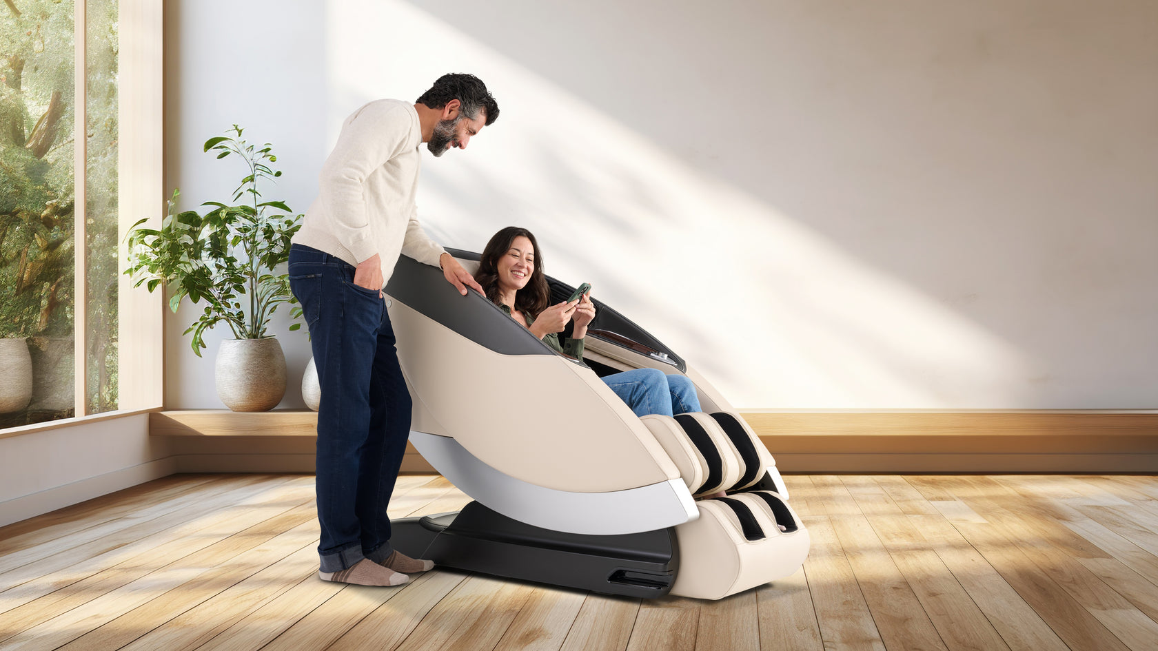 Man Standing and woman sitting on Super Novo 2.0 in cream looking at her phone