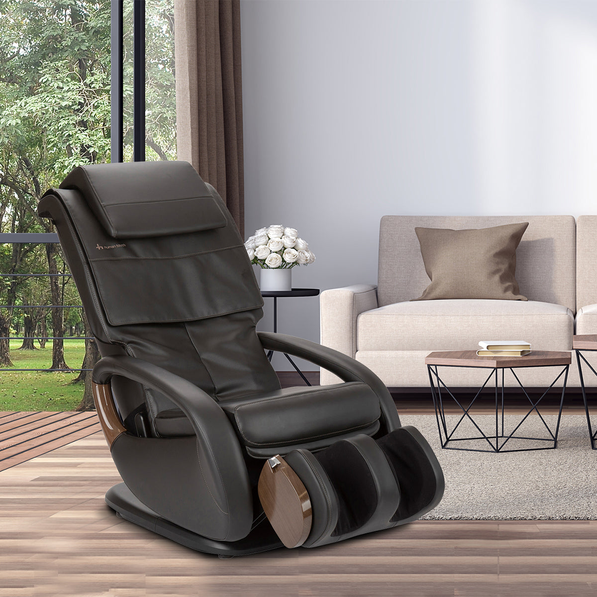 WholeBody 8.0 massage chair in black leather, positioned in modern living room with window view and natural light