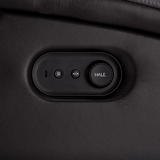 Control panel with buttons on a black leather surface